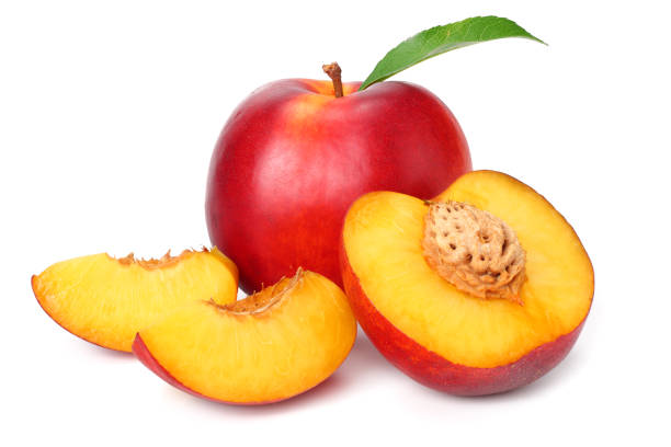 istock Nectarine with green leaf and slices isolated on white background 1162290156