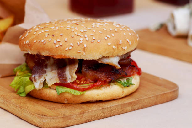 istock Burger on a wooden board 1162291053