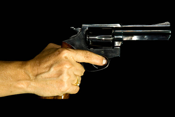istock Female Hand Holding a Revolver 116229194