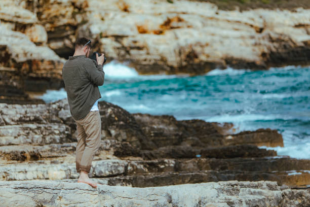 istock professional photographer shooting seascape 1162294942