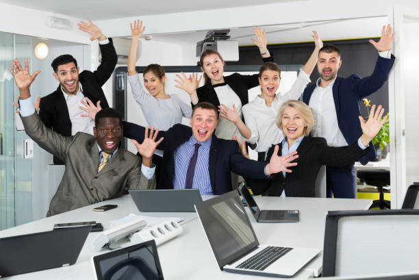 istock International business group expressing satisfaction with teamwork 1162295920