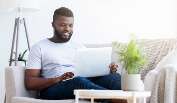 istock African american man browsing work opportunities on laptop 1162297015