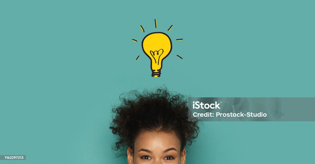 Glowing idea lamp above african woman head Brainstorming and inspiration concept. Glowing idea lamp above african woman head, turquoise panorama background Inspiration Stock Photo