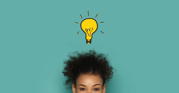 Glowing idea lamp above african woman head Brainstorming and inspiration concept. Glowing idea lamp above african woman head, turquoise panorama background ideas stock pictures, royalty-free photos & images