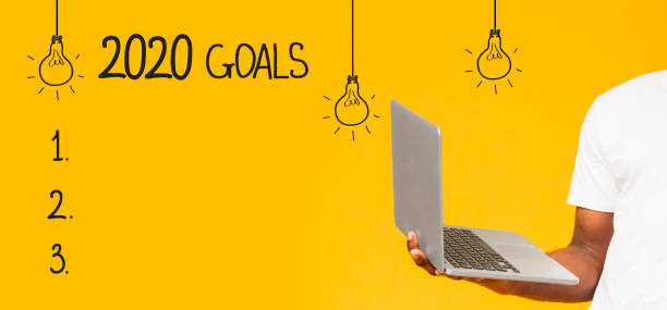 istock Blank checklist and african guy holding laptop 1162297625