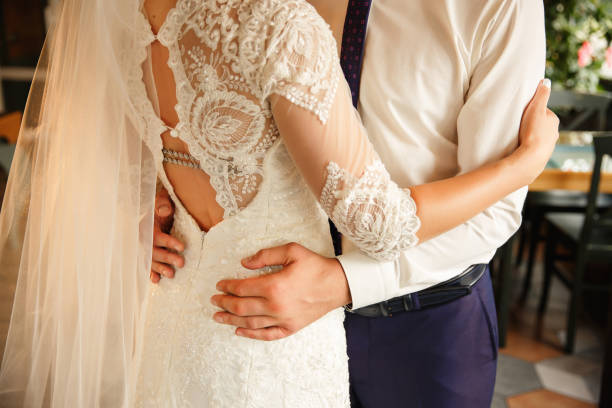 istock Wedding couple. Bride and groom embracing at wedding day 1162298030