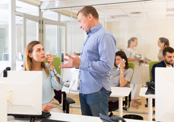 istock Irritated boss scolding female subordinate 1162298121