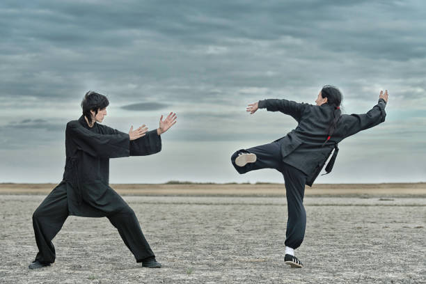 istock People Practicing Martial Arts On Land Against Cloudy Sky 1162298210