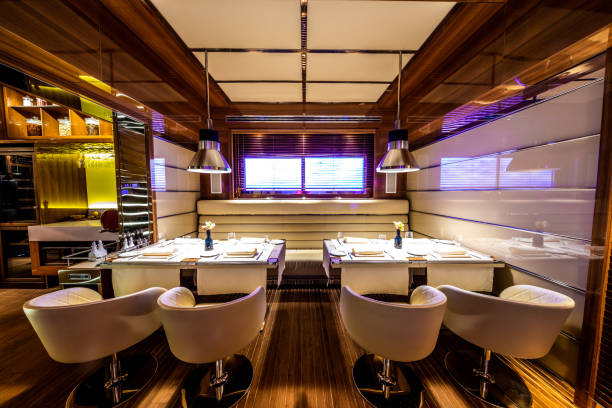 istock Two tables next to each other in a modern, high class restaurant 1162301315