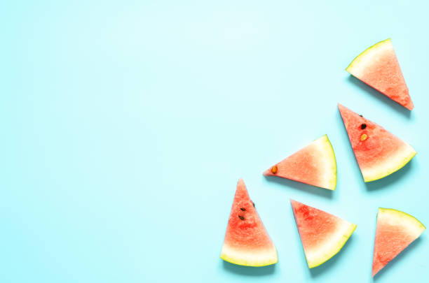 istock Fresh red watermelon slice Isolated light blue background.  Summer concept.Top view, Flat lay, Copy space. - Image 1162301362