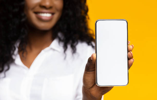 istock African millennial woman showing blank cellphone screen 1162301370