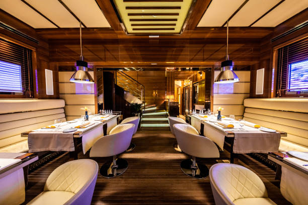 istock Between two rows of tables in an exclusive yachting style restaurant 1162301459