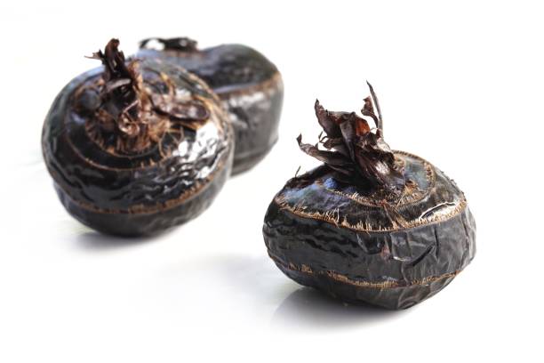 istock Boiled Truffles or boiled Chinese water chestnut on white background, Selective focus and free space for text. Shooting in studio for advertising. 1162302075