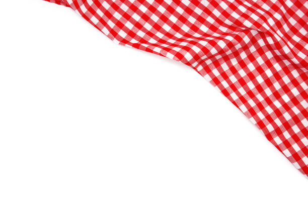 istock Wrinkled red gingham fabric isolated on white background. 1162302083