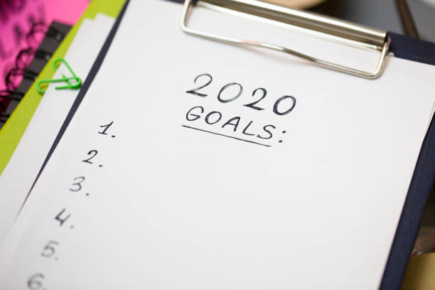 istock Close up of clipboard with black handwriting text on white 1162302307