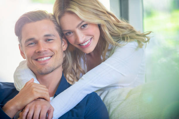 istock Couple relaxing on the sofa. 1162302400