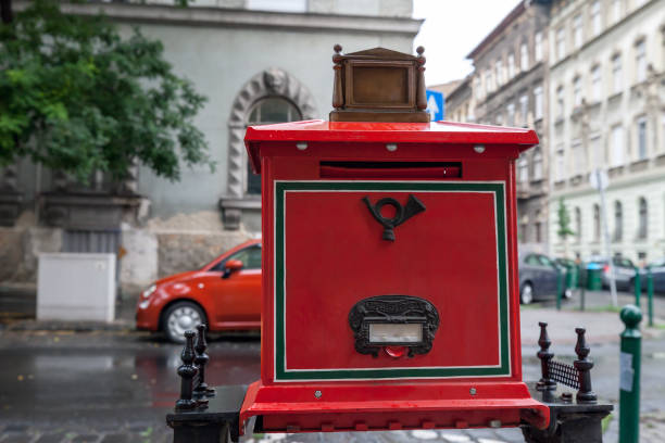 Budapest, Hungary - 16 June 2019: Red mailbox on city street in Budapest, Hungary