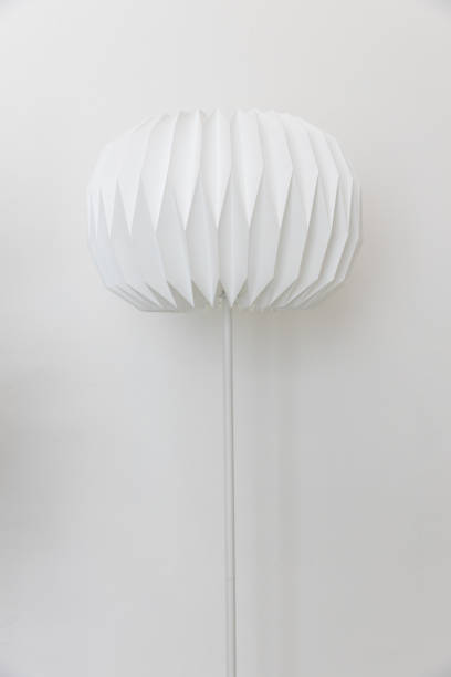 istock The single unique round shape paper electric floor lamp on white wall background. 1162303097