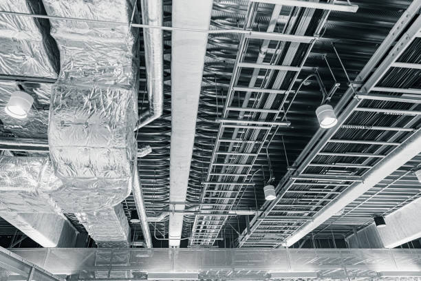 istock ceiling air pipe air ventilation and manged data cables in a cableway on the office roof 1162304669