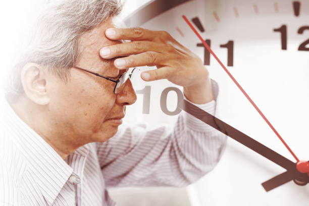 elder man time losing his memory from amnesia.  Brain Stroke death clock countdown concept.