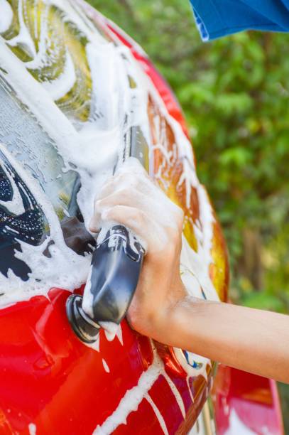 istock Car wash with flowing water and foam 1162305485