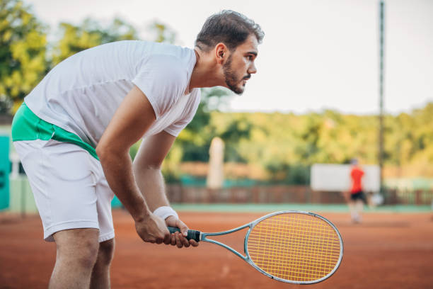 istock Man tennis player waiting for the ball 1162307709