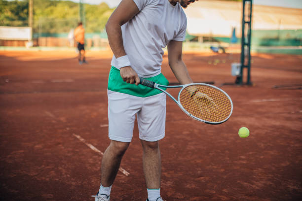 istock Man tennis player getting ready to serve 1162308520