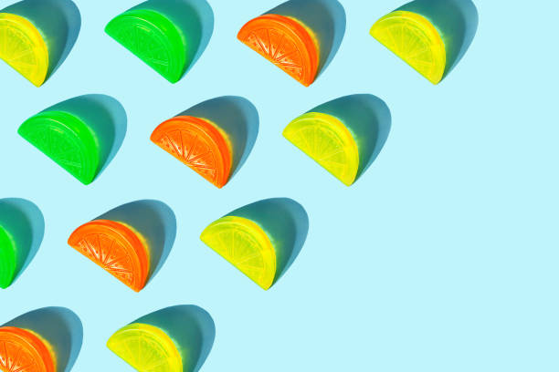 Colorful ice cream popsicle pattern on bright orange background.