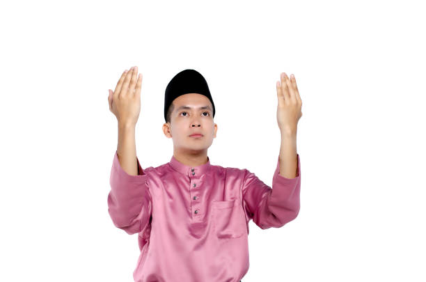 istock Young Man Praying Against White Background 1162309501