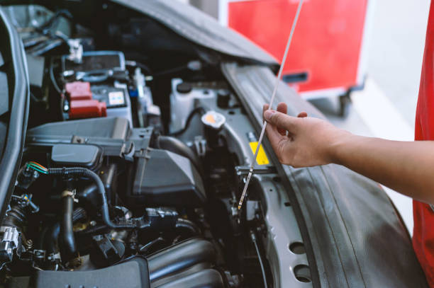 istock mechanic working car maintenance with soft-focus and over light in the background 1162312126