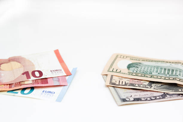 istock American Dollar and Euro Banknotes isolated on white background. 1162313166