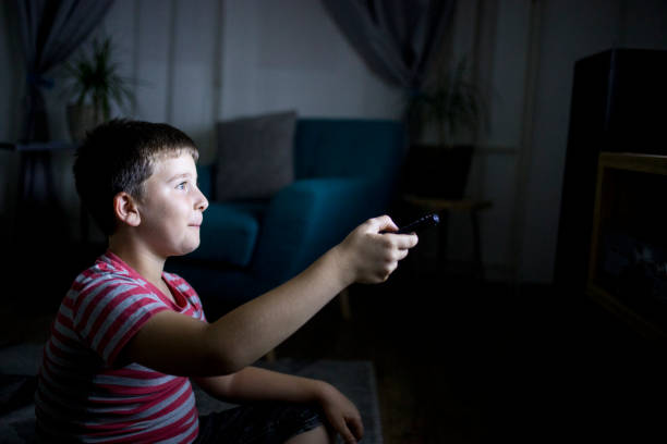 istock Boy in front of tv 1162315128