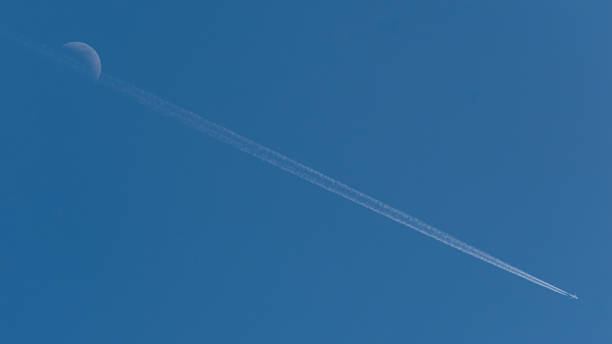 istock The Moon and the Plane 1162315915