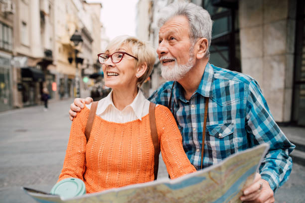 istock Senior tourists hugging and holding the map 1162317688
