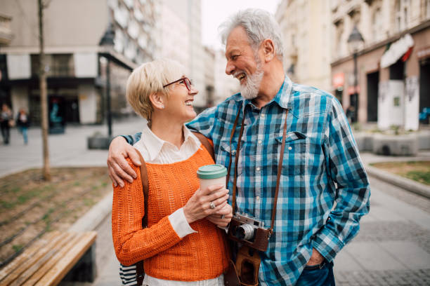 istock Elderly tourists hugging and smiling 1162317691