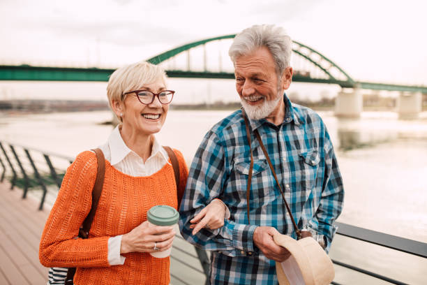 istock Mature couple in front of the bridge smiling 1162317877