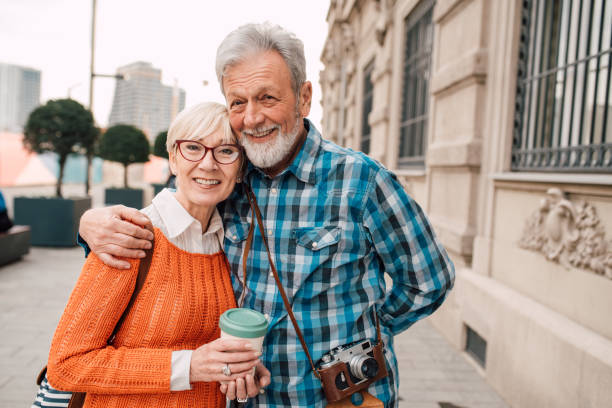 istock Mature tourists hugging and smiling 1162318092