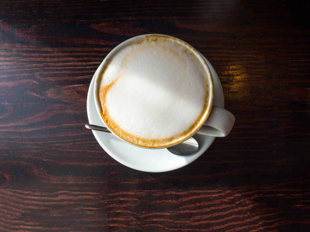 istock Cup of coffee on a wooden table. 1162319505