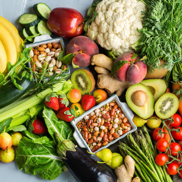 Healthy food for balanced alkaline diet concept Balanced nutrition concept for clean eating alkaline diet. Assortment of healthy food ingredients for cooking on a kitchen table. Top view flat lay background alkaline stock pictures, royalty-free photos & images