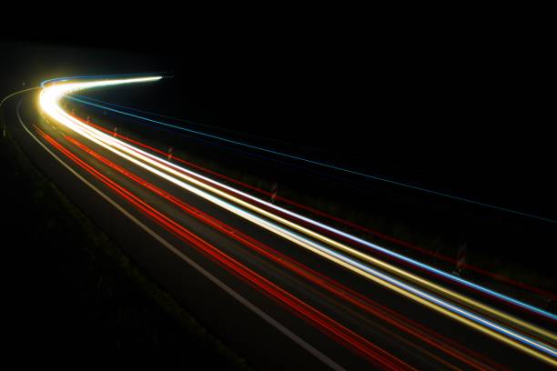 istock lights of cars with night 1162329599