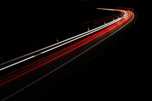 istock lights of cars with night 1162329603