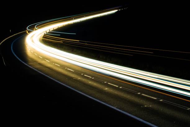 istock lights of cars with night 1162329604