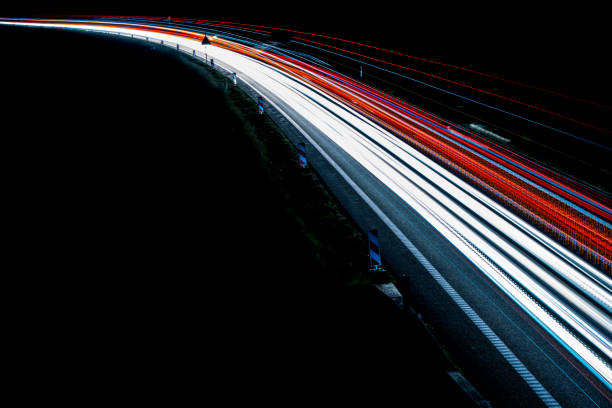 istock lights of cars with night 1162329606