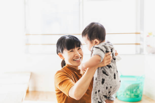 istock Mother carrying her baby 1162329632