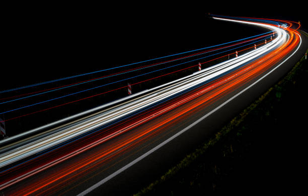 istock lights of cars with night 1162329667