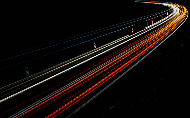 istock lights of cars with night 1162329676