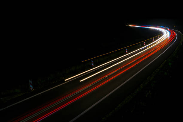istock lights of cars with night 1162329690