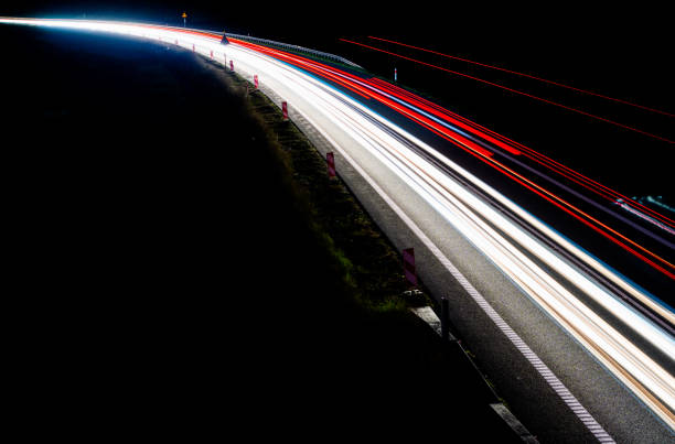 istock lights of cars with night 1162329720