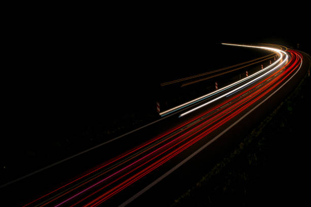 istock lights of cars with night 1162329761
