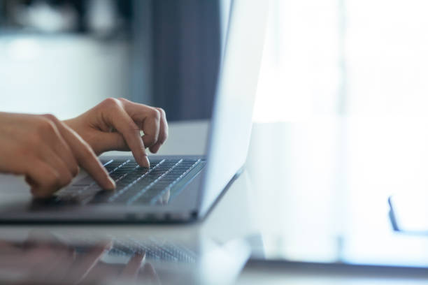 istock Hands of a girl working on a laptop 1162330279